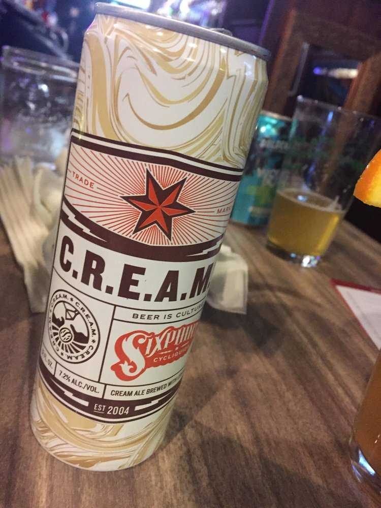 A tall can of craft beer at the bar