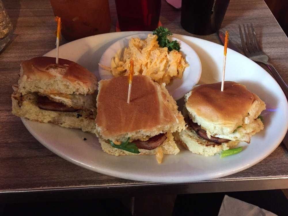 Three sandwiches with a side